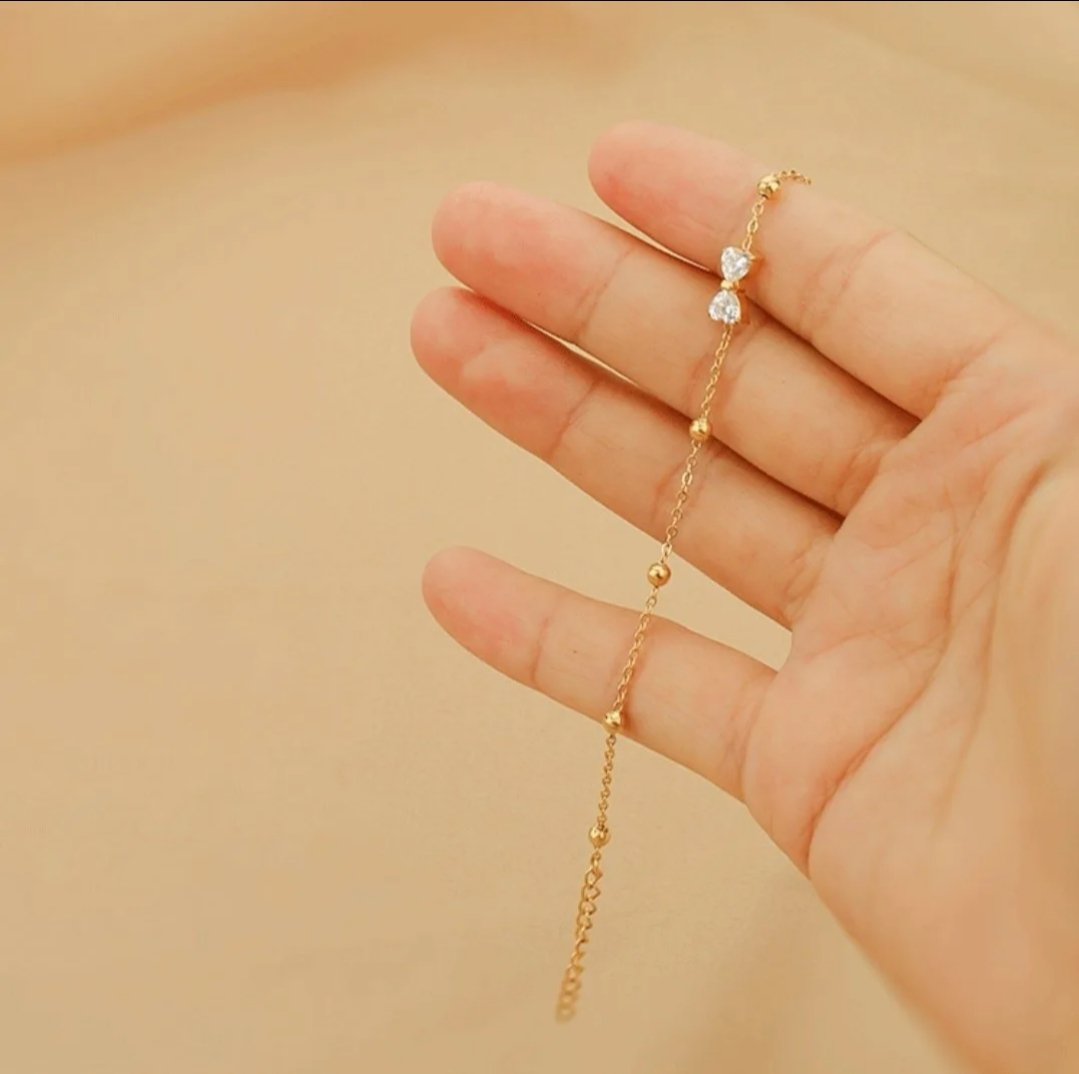 Seraphic Bow Anklet on ankle — elegant everyday gold anklet Pakistan | Glitze Accessories