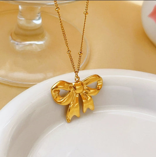 Chunky Bow Necklace in 18K gold plated stainless steel by Glitze Accessories — statement bow necklace for everyday wear