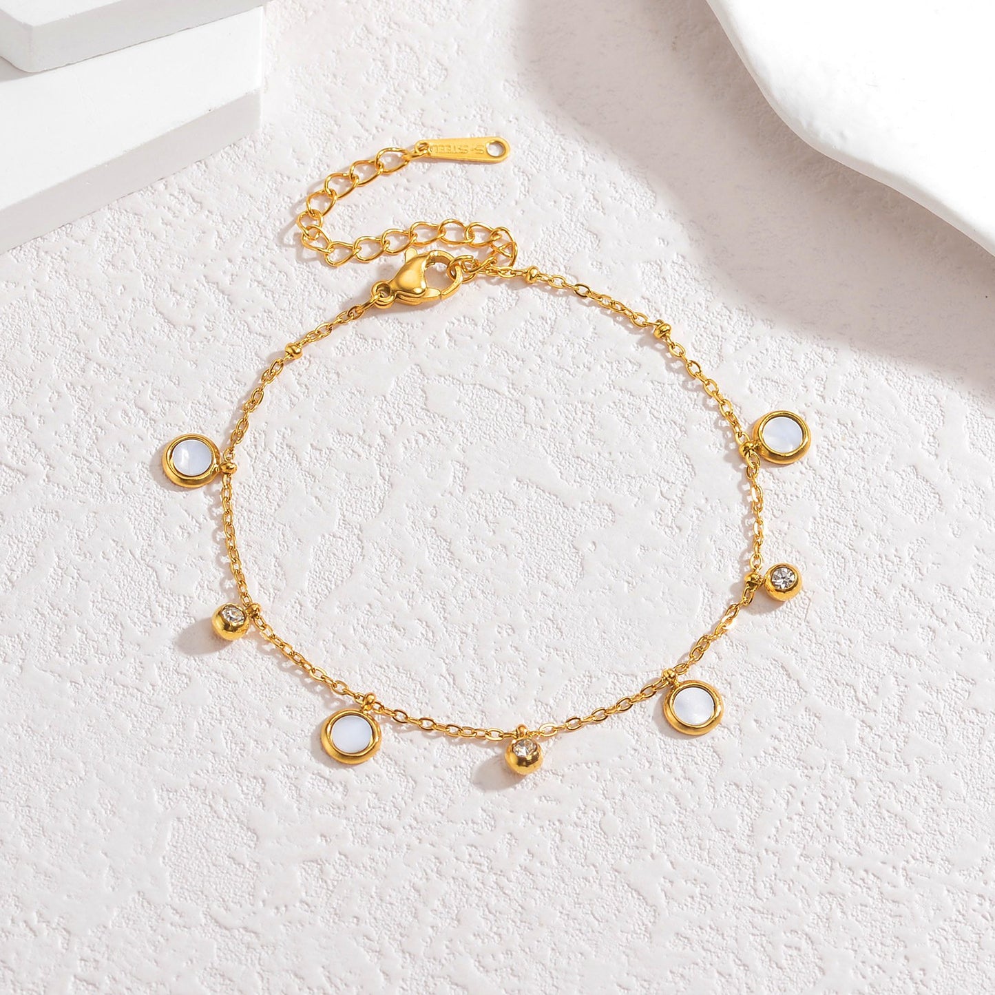 Aurya Bracelet White — 18K gold plated white stainless steel bracelet by Glitze Accessories Pakistan