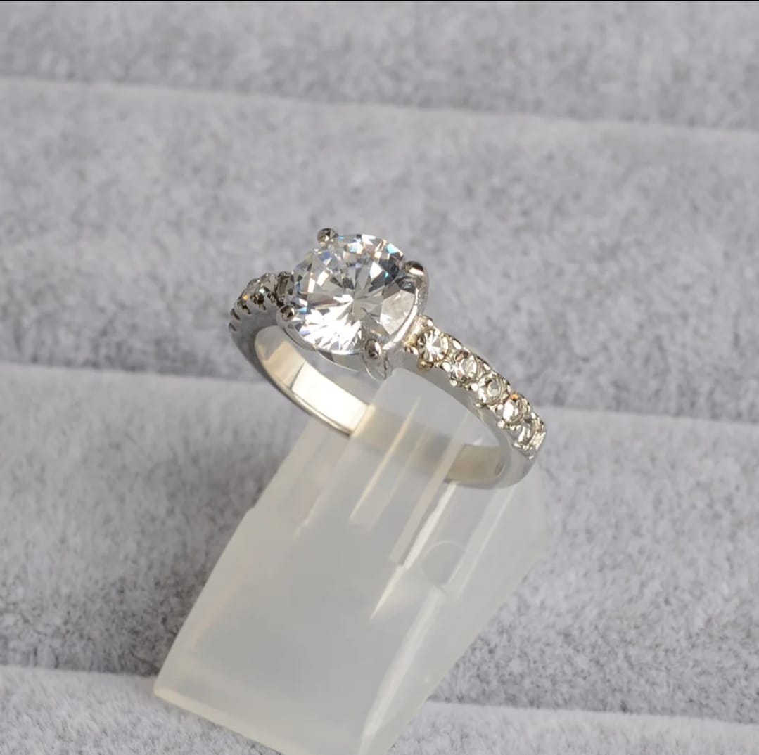 Variety of Zirrel jewelry pieces from Glitze Accessories in different styles and finishes displayed on a neutral background.