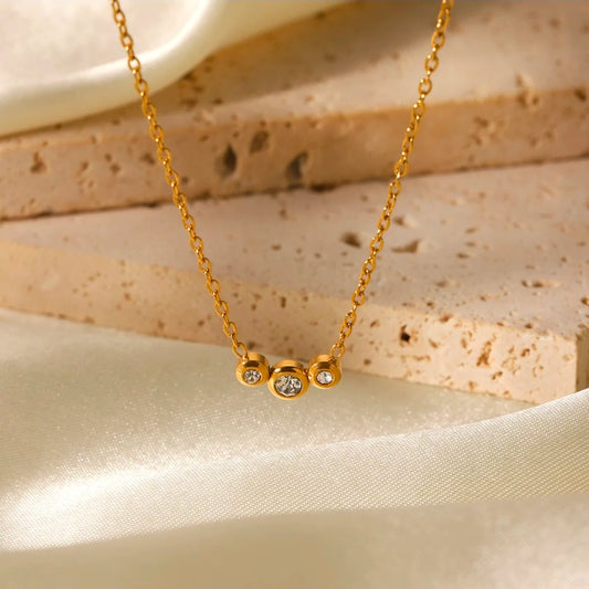 Asteria Necklace three-stone crystal pendant close up
