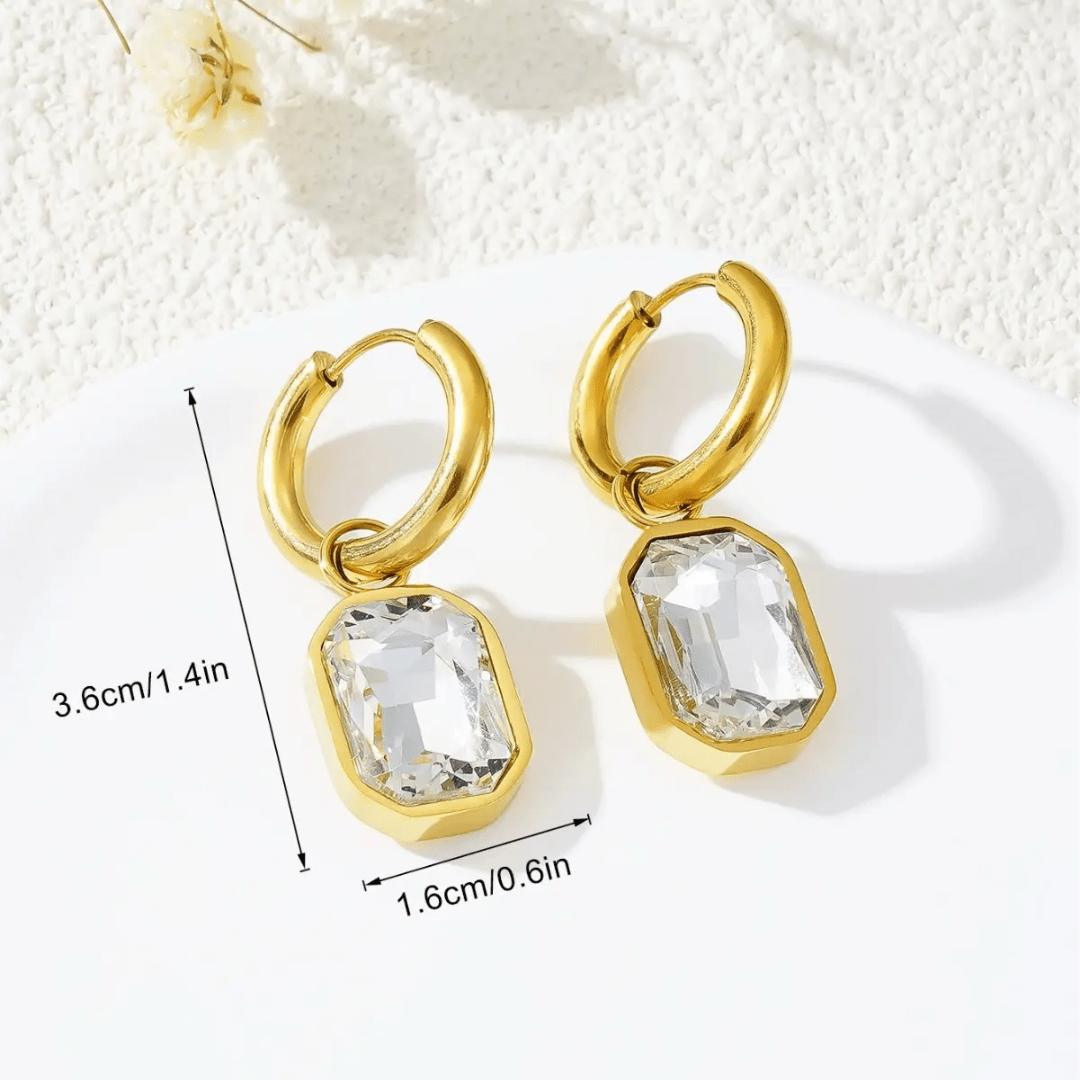 White Gemma Earrings by Glitze Accessories featuring sparkling gemstone details and elegant dangle design.