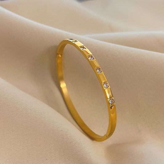 Zitah Bangle side view – slim gold stainless steel cuff by Glitze Accessories