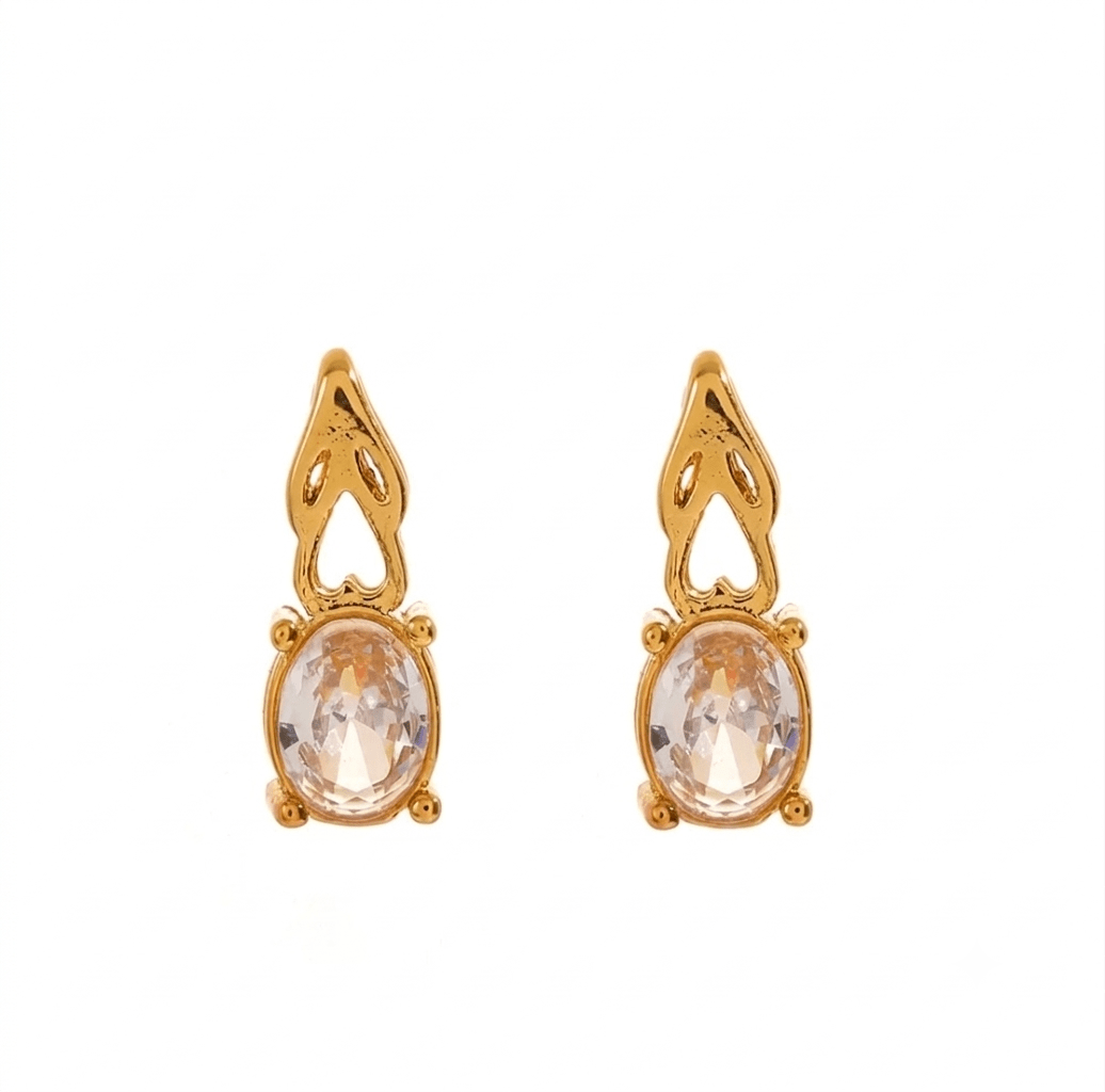 Aveline bracelet by Glitze Accessories featuring delicate gold-tone chain and charm details on a white background.