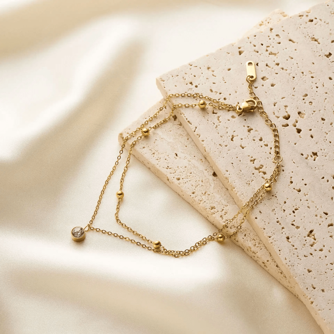 Simple silver Luminara anklet by Glitze Accessories featuring delicate chain design on a neutral background.