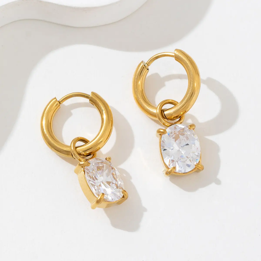 Ova Earrings — gold huggie hoops with oval crystal drop, 18K gold plated stainless steel | Glitze
