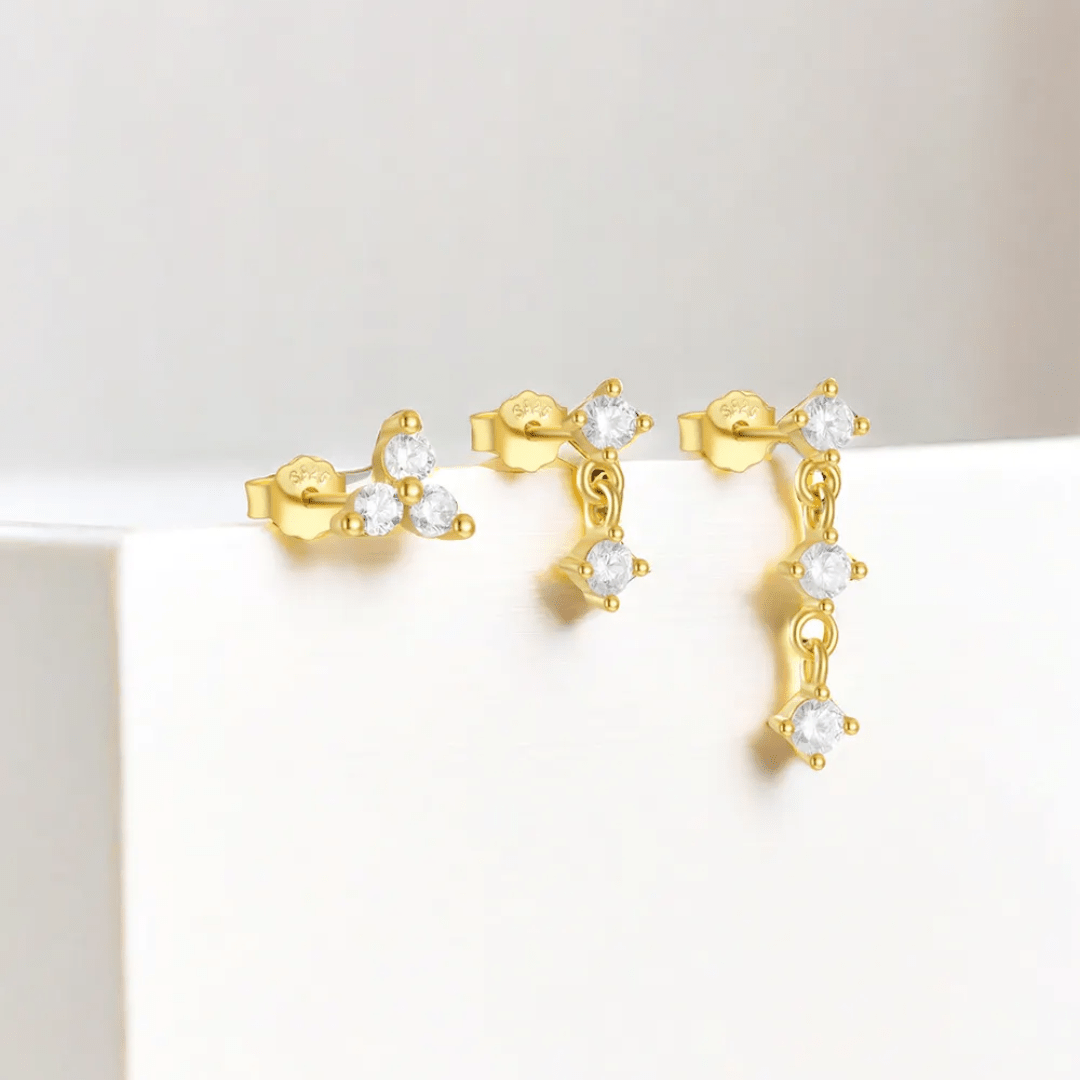 Glitze Accessories Mina Stack featuring layered gold rings with minimalist design and textured details on a white background.