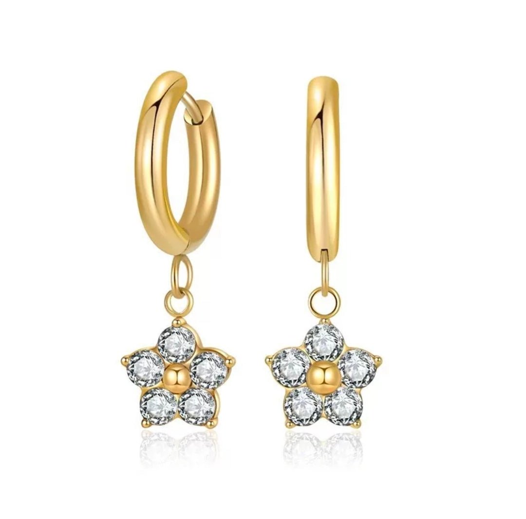 Close-up of a colorful artificial tulip flower from Glitze Accessories with vibrant petals and green leaves.