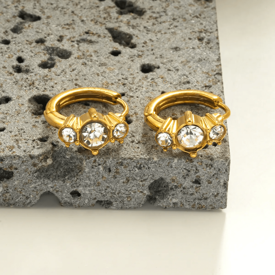 Glitze Accessories Dew hair accessory featuring a decorative rhinestone design and elegant metallic finish.