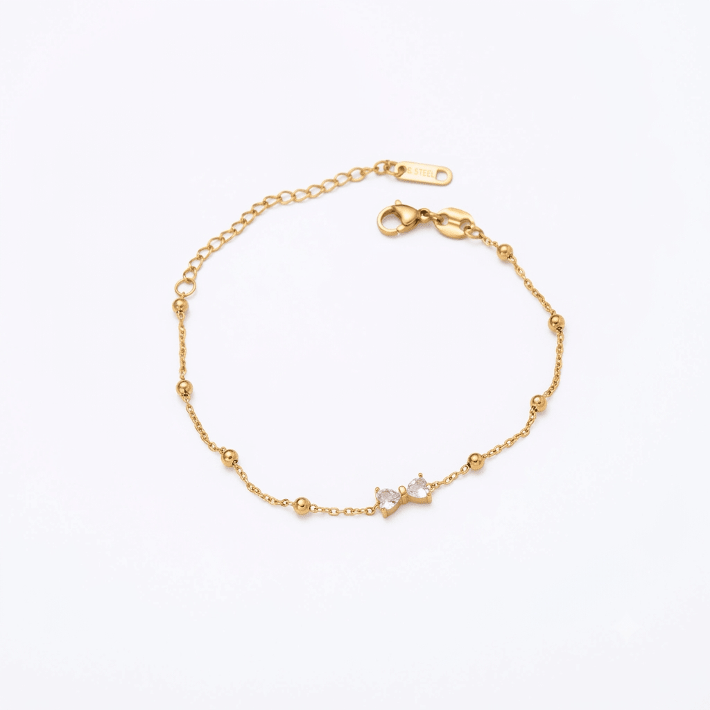 Simple silver Seraphic Bow Anklet by Glitze Accessories featuring delicate bow charm on a thin chain.