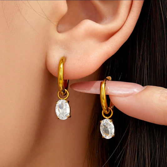 Ova Earrings, gold huggie hoops with an oval crystal drop, 18K gold plated stainless steel