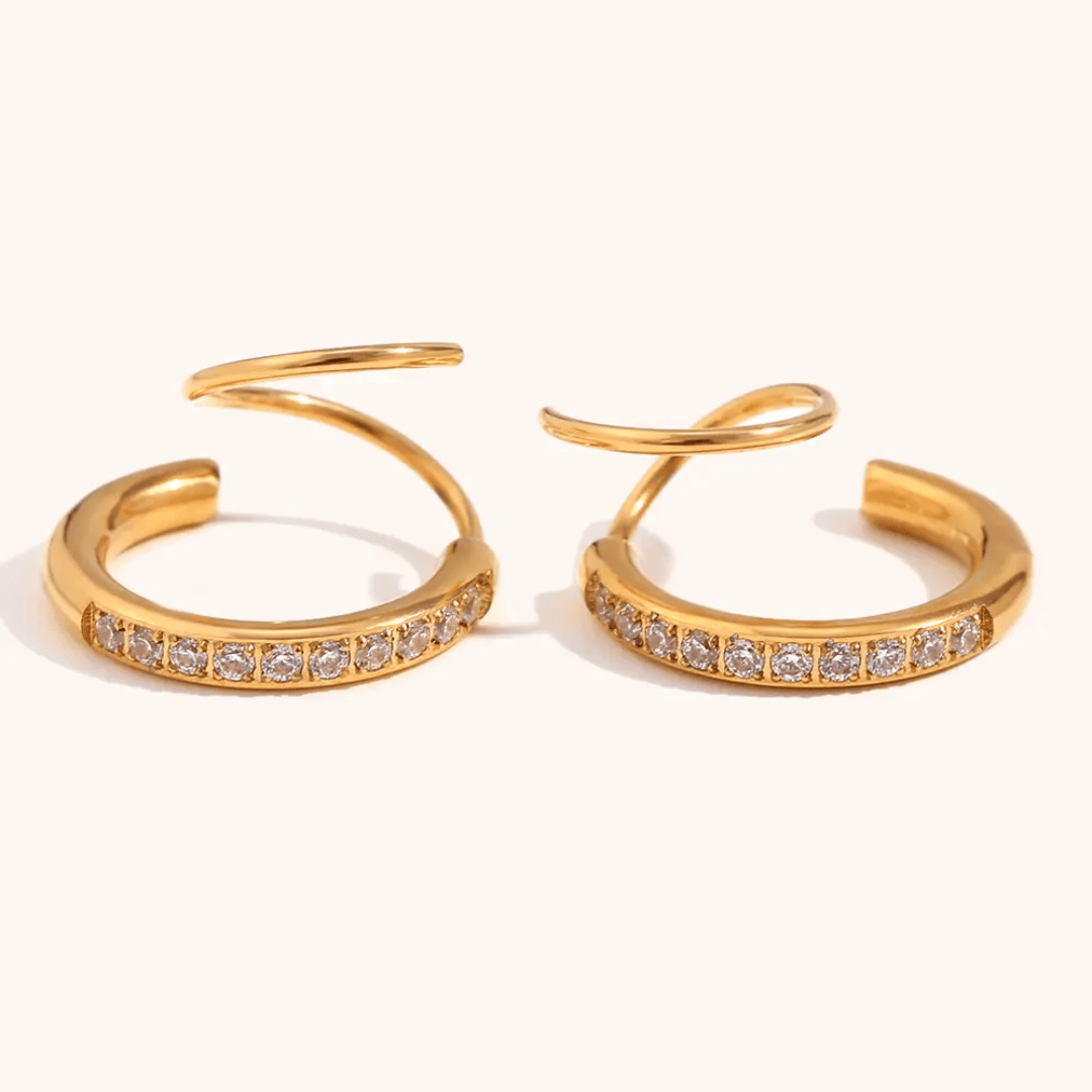 Silver loop earrings by Glitze Accessories featuring sleek, minimalist design with smooth, rounded hoops.