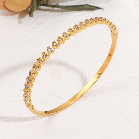 Adora Bangle detail – slim hinged stainless steel bangle with crystal hearts by Glitze Accessories