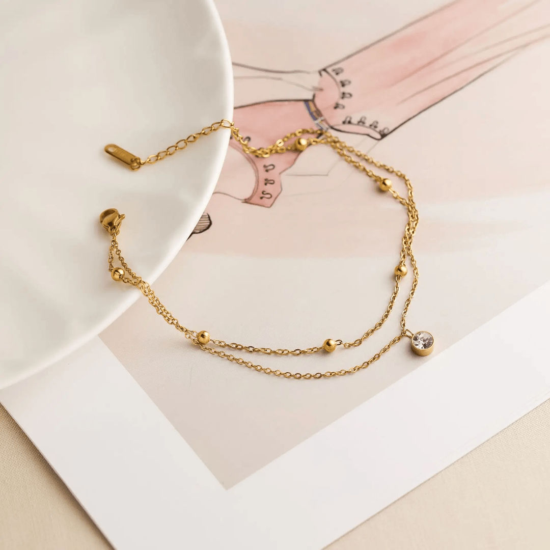 Simple silver Luminara anklet by Glitze Accessories featuring delicate chain design on a neutral background.