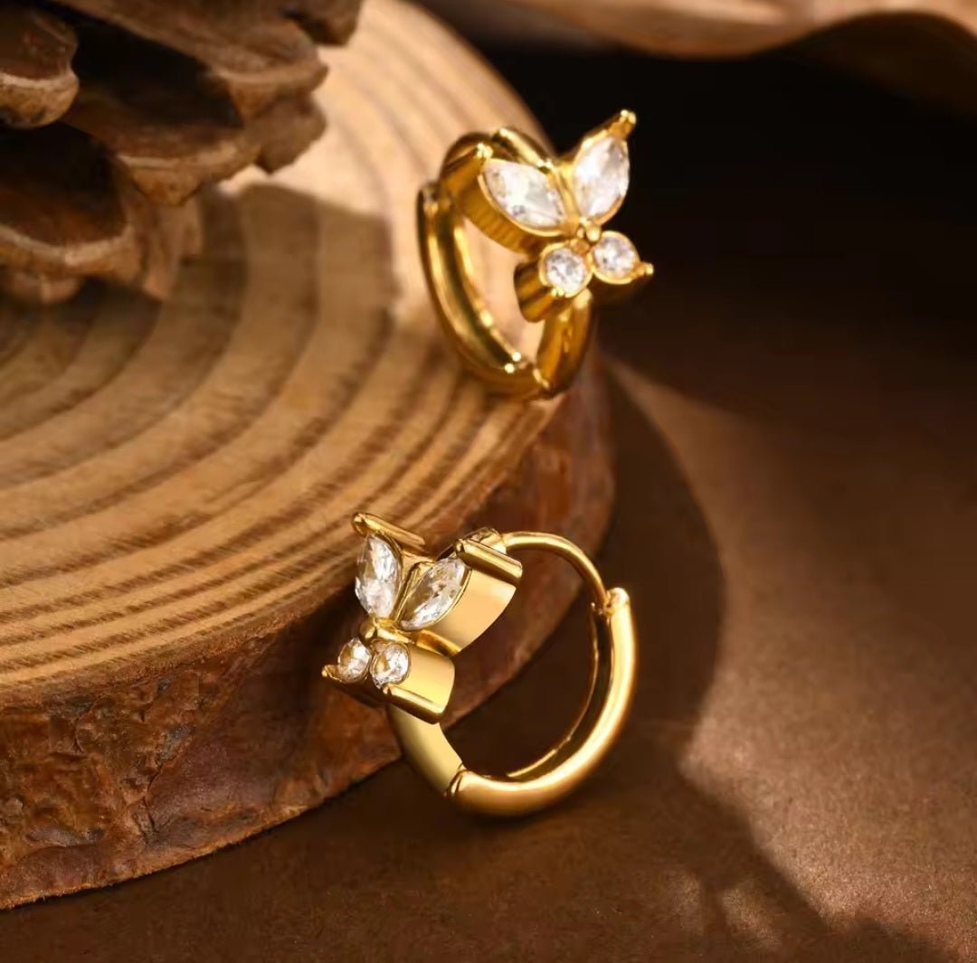 Simple butterfly jewelry piece by Glitze Accessories featuring a delicate butterfly design in silver-tone metal.