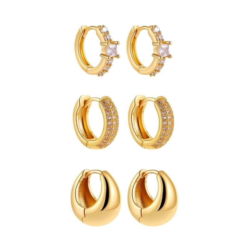 Glitze Accessories Ivy Stack jewelry set featuring layered gold-tone necklaces with green leaf charms on a white background.