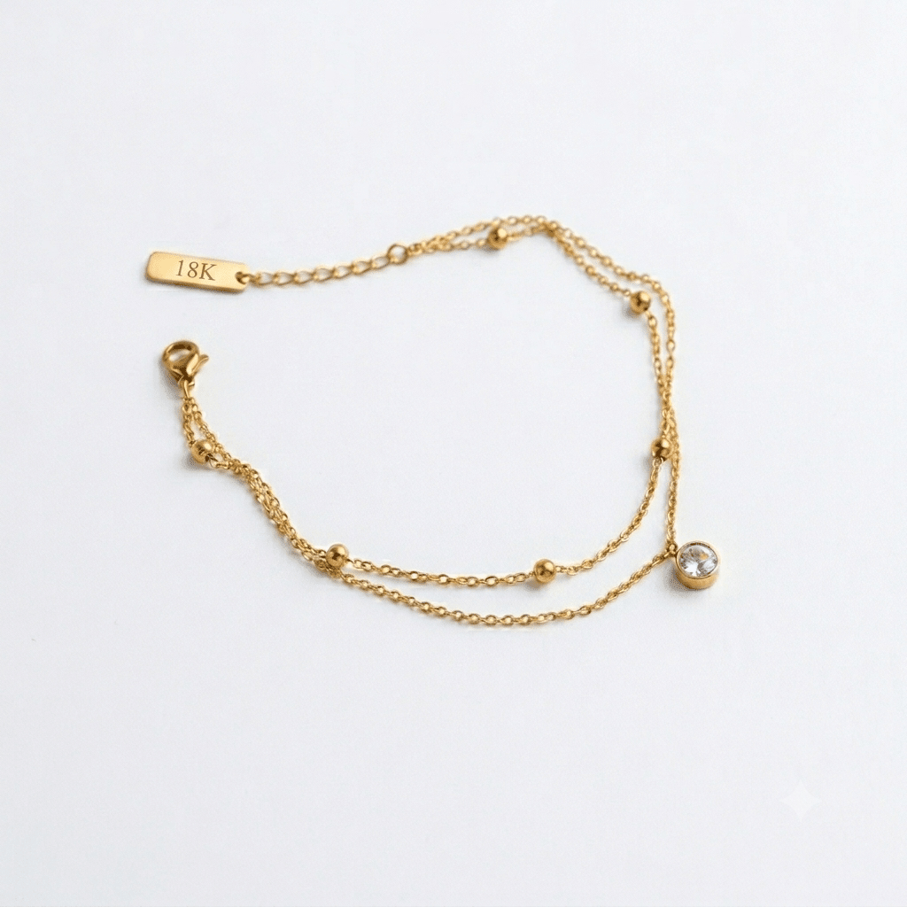Simple Luminara anklet by Glitze Accessories featuring delicate chain design on a bare ankle.