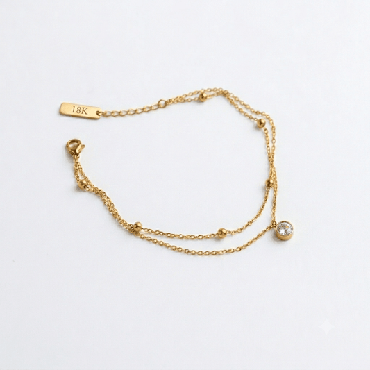 Simple Luminara anklet by Glitze Accessories featuring delicate chain design on a bare ankle.
