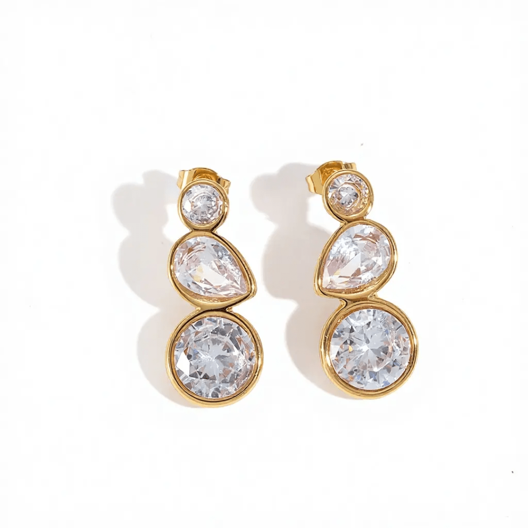 Glitze Accessories Grace earrings featuring elegant design with sparkling gemstones and silver-tone metal.