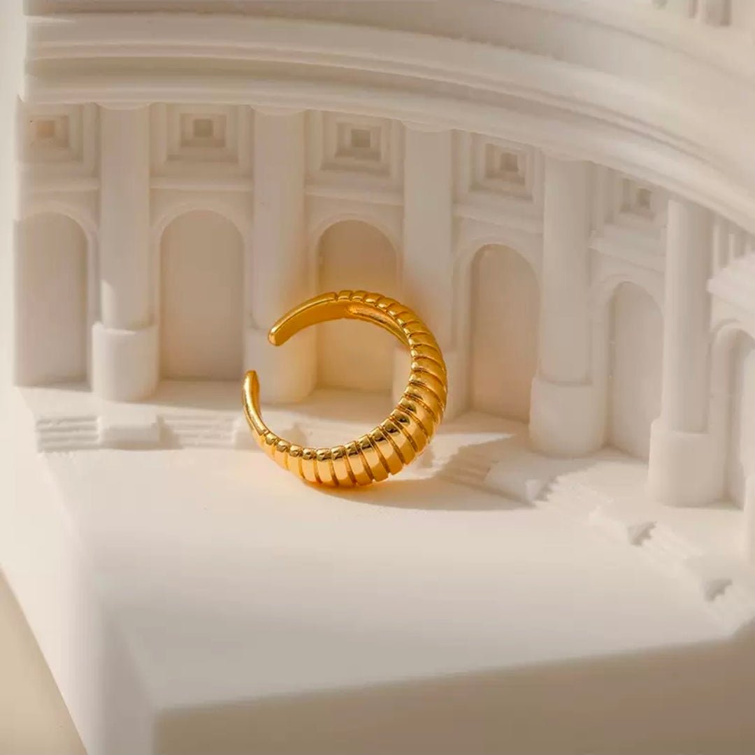 Cleo by Glitze Accessories, stylish jewelry piece with intricate design, displayed on a neutral background.