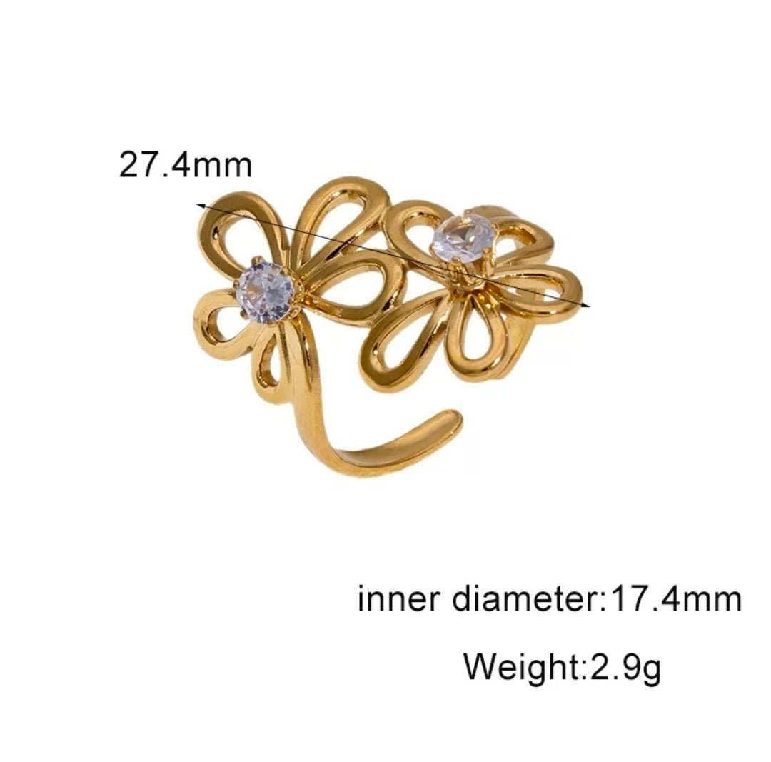 Glitze Accessories Ether jewelry piece featuring intricate design and shiny metallic finish on a neutral background.