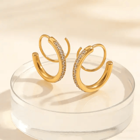 Silver loop earrings from Glitze Accessories featuring smooth, circular design perfect for everyday wear.