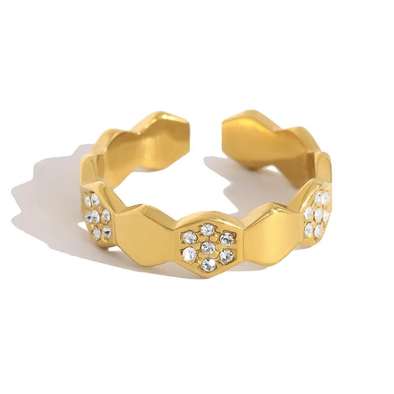 Glitze Accessories Apex jewelry piece with intricate design and shiny finish, displayed on a neutral background.