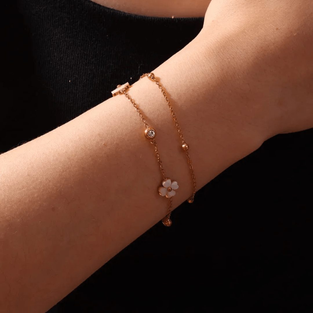 Simple Lily Bracelet by Glitze Accessories featuring delicate floral design and silver-tone chain on a neutral background.